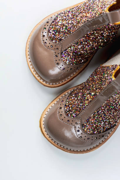 istock Little kids boots with glitter on white 2164653039