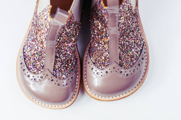 Little kids boots with glitter on white