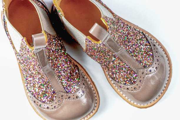 istock Little kids boots with glitter on white 2164653062