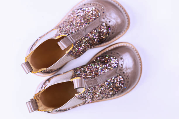 istock Little kids boots with glitter on white 2164653075