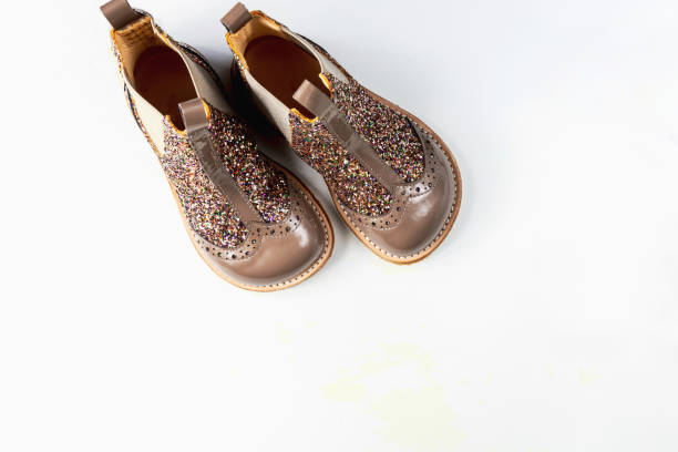 istock Little kids boots with glitter on white 2164653082