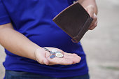 poor-man-hold-leather-wallet-with-some-c