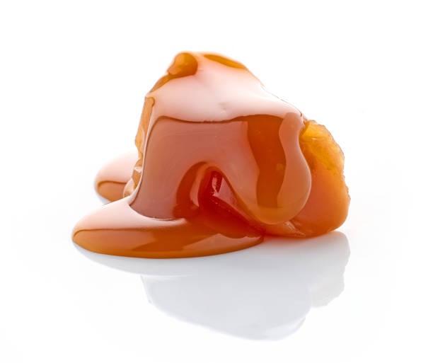 istock caramel candy with melted caramel sauce 2164654399