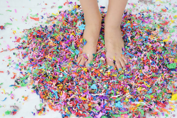 istock A Person Standing In Colored Confetti 2164654631