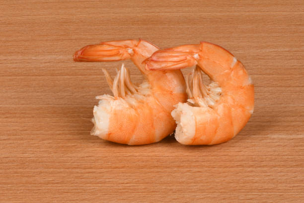 Perfectly retouched shrimp on wood background. High resolution photo. Full depth of field.
