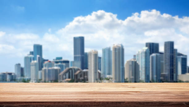 Empty outdoor wooden surface with copy space over cityscape