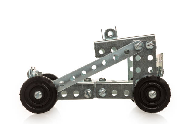 istock Metal Model Car Construction Set: A buildable metal model car with crisp angular shapes, perforated plates and visible fasteners. Realistic details and moving parts such as rotating wheels. 2164662269