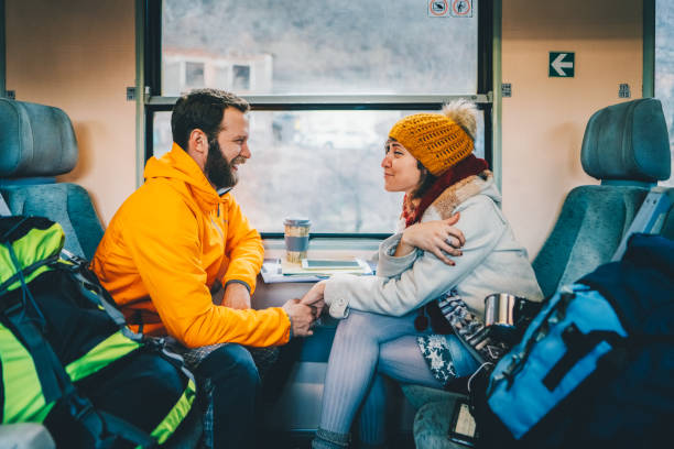 istock Couple traveling in train 2164663104