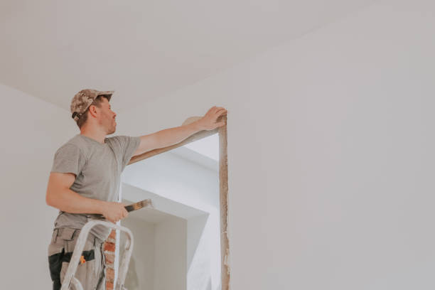 istock A young Caucasian male builder clears a doorway using a crowbar. 2164663471