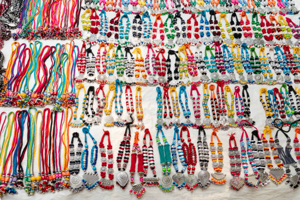 istock Traditional handmade multicolour fancy satin decorative Mala or necklace with plastic beads, selling at Sonajhuri haat at Shantiniketan, West Bengal 2164665017