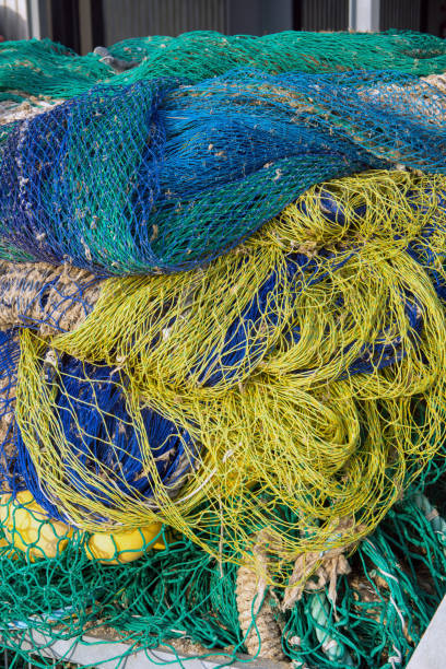 istock Tangle of Green, Blue, and Yellow Nets 2164665556