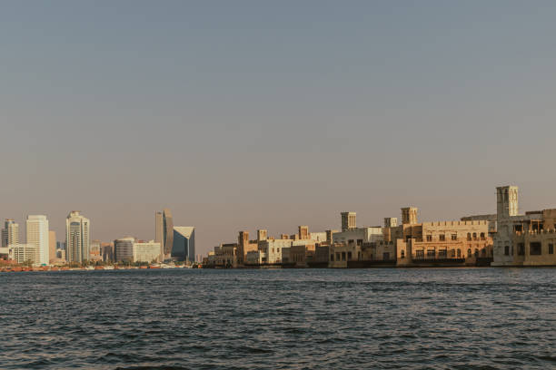 City skyline and waterfront view from traditional wooden boat on the sea