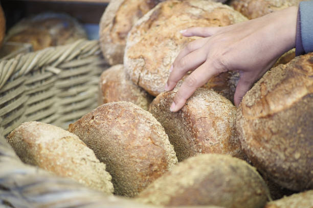 istock Selecting fresh bread from an artisan bakery basket is a delightful experience for food enthusiasts 2164667513