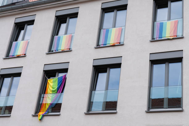 istock Colorful rainbow flags displayed on apartment balconies during pride month 2164669366