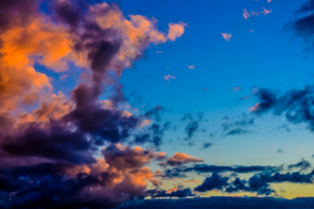 istock The sky is filled with clouds and the sun is setting 2164669446