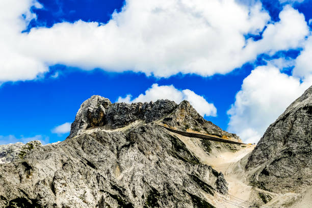 istock A mountain with a cloudy sky in the background 2164669559