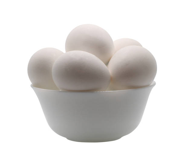 istock Chicken eggs in a bowl. Isolated on white background 2164669584