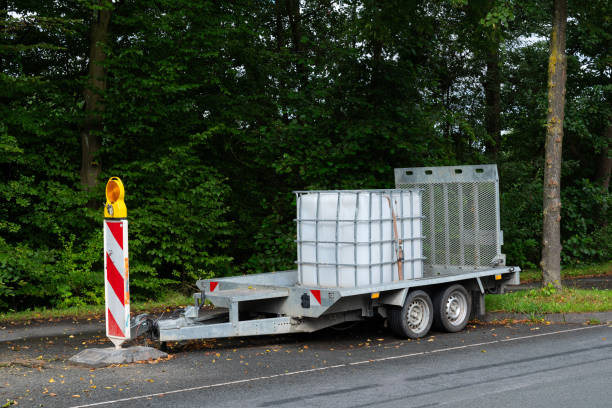 Trailer with storage containers positioned alongside roadway