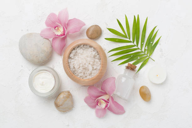istock Composition with orchids, spa products on concrete background, top view 2164674045