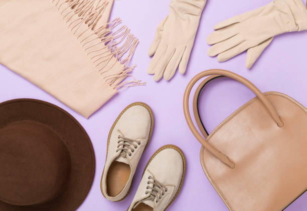Stylish autumn accessories on color background, top view