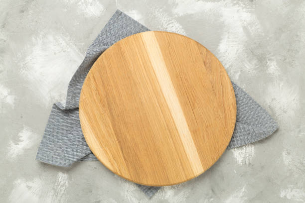 istock Cutting board with napkin on concrete background, top view 2164675518