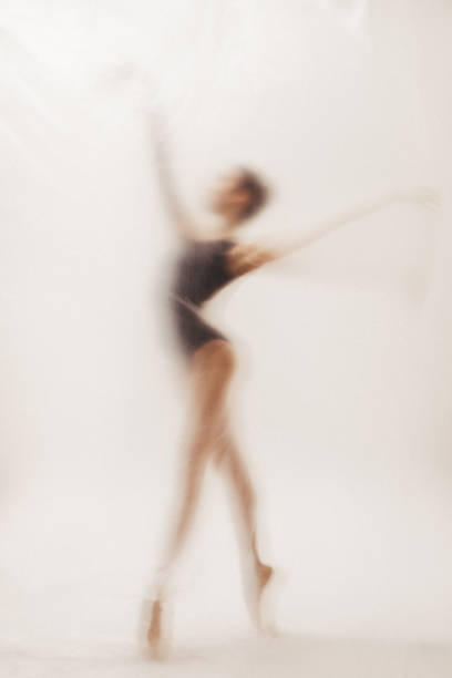 istock Beautiful ballerina dancing on the stage 2164676738