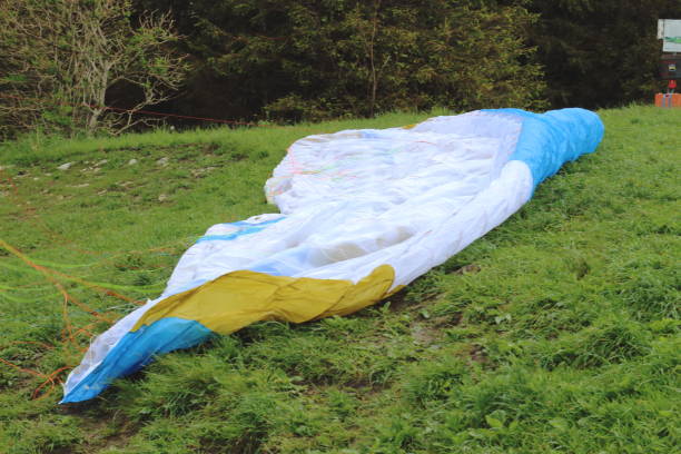istock Paraglider on the Ground Being Prepared for Takeoff 2164677146