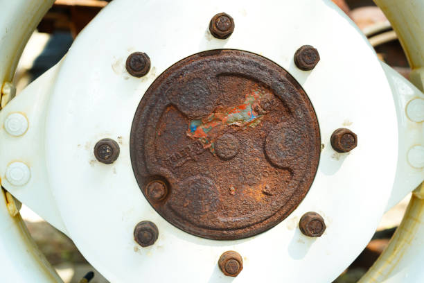 Rust hub of the old wheel, texture.Corrosive grunge rusted on old iron wheel. Pattern grunged rust as illustration for presentation background. Rusty corrosion or oxidized background.Close up.