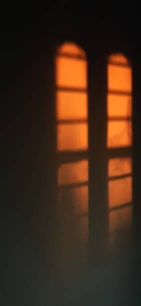 istock Shadow of window on a wall during sunset 2164678334
