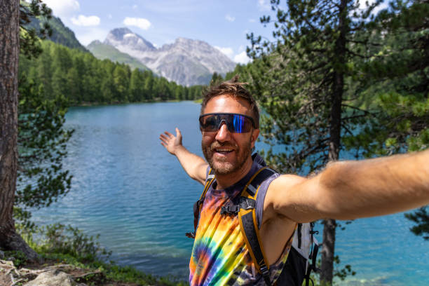 istock Man Taking Selfie by Mountain Lake 2164689794