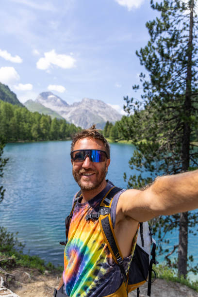 istock Man Taking Selfie by Mountain Lake 2164689819