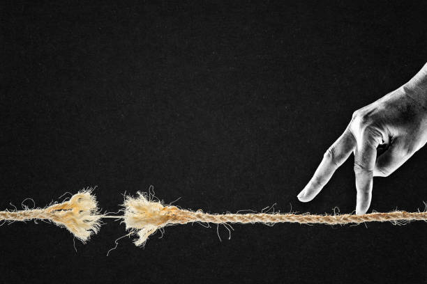istock Fingers Walking Over Frayed Rope About to Break 2164697149