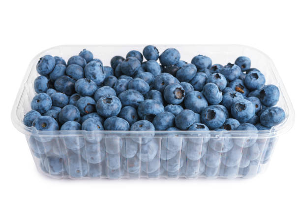 istock Fresh raw organic blueberries in transparent plastic container isolated on white background 2164699279