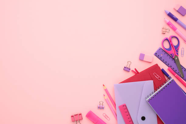 istock Flat lay composition with school stationery, paper notebook, envelope, ruler, scissors, clips, pen, pencil on pink background. Back to school concept. 2164700948