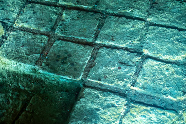 Green blue rock texture. Old marble surface texture under the water.
