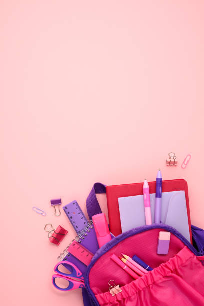 istock School backpack with stationery on pink background. Back to school concept. Flat lay, top view. 2164701502