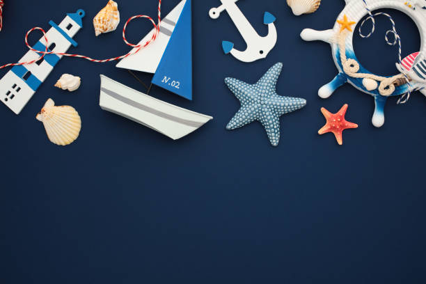 istock Explore nautical charm with this vibrant collection of maritime objects on dark blue backdrop. Ideal for summer or travel themes 2164703053