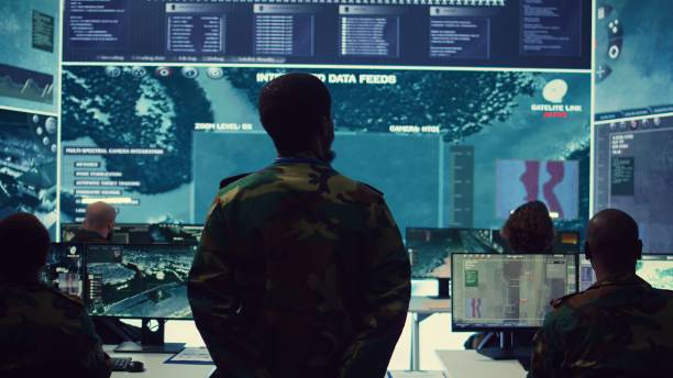 istock Staff sergeant monitoring satellite live imagery on a big screen 2164704115