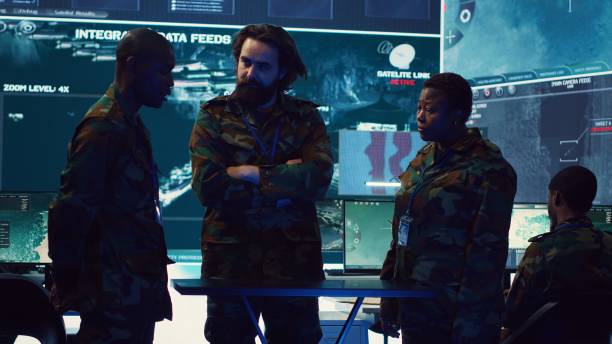 istock Brigadier general and his staff studying radar data on a holographic image 2164705237