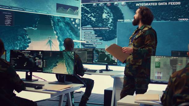 istock Army major reads operation details from a case file in a control center 2164706059