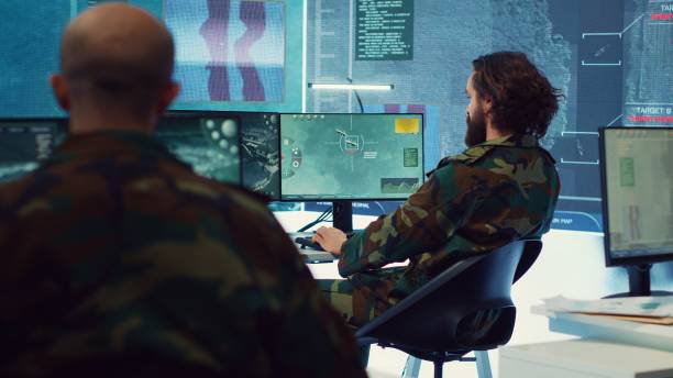 istock Diverse team of navy operators gather intelligence for future field missions 2164707075