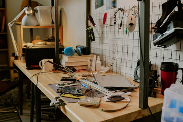 istock Wooden Table with Computer Details and Tool Kit 2164708483