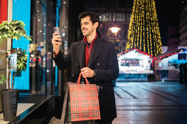 istock Happy man in Christmas shopping 2164712229