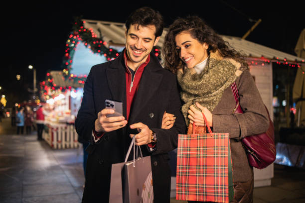 istock Happy couple shopping for Christmas 2164712241