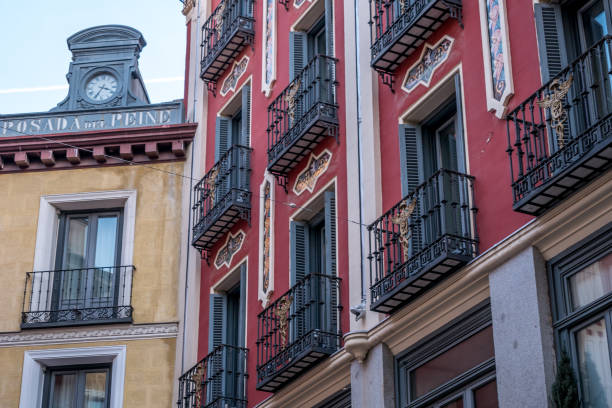 Madrid, Spain - January 10, 2020: Typical building facade of Madrid architecture, with its colors, windows and balconies
