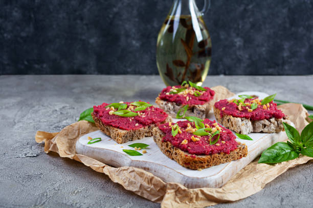 istock Toasts with beetroot, chopped nuts and herbs. Vegan bruschetta with beet 2164717057