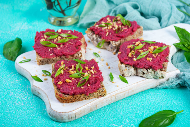 istock Toasts with beetroot, chopped nuts and herbs. Vegan bruschetta with beet 2164717058