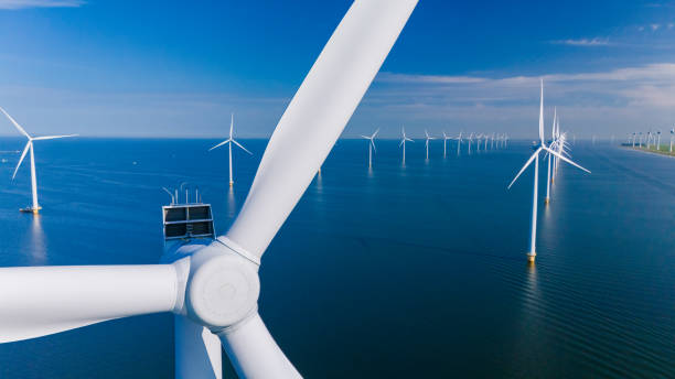 istock Captivating Wind Turbines Generating Renewable Energy Over Dutch Waters 2164721152
