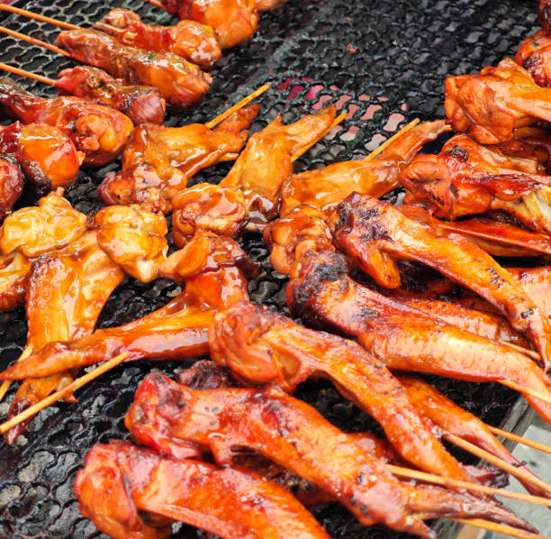 istock grilled chicken wings placed on metal grid 2164729772
