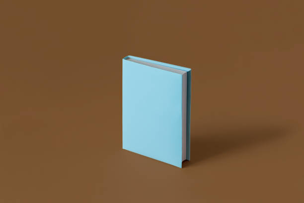 istock One blue book on a brown background with soft shadow, copy space. Book Lovers Day concept 2164731757